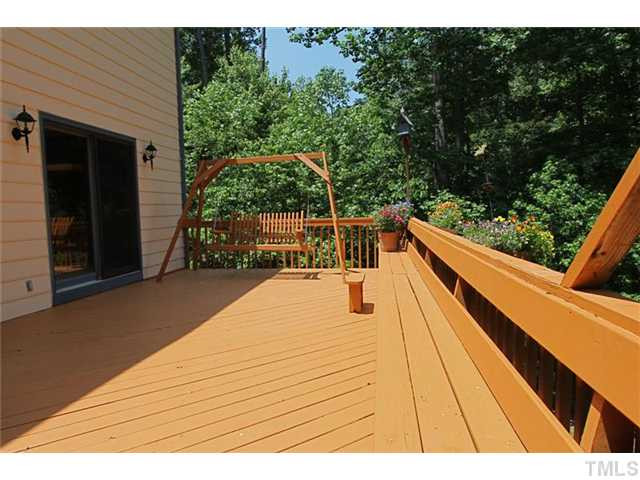 10604 Brownsburg Place Raleigh, NC 27613 - Photo 22 of 25 Double Sized Deck hedged by a canopy of mature hardwood trees Patio/Deck