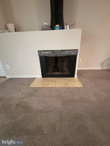 a living room with a fireplace