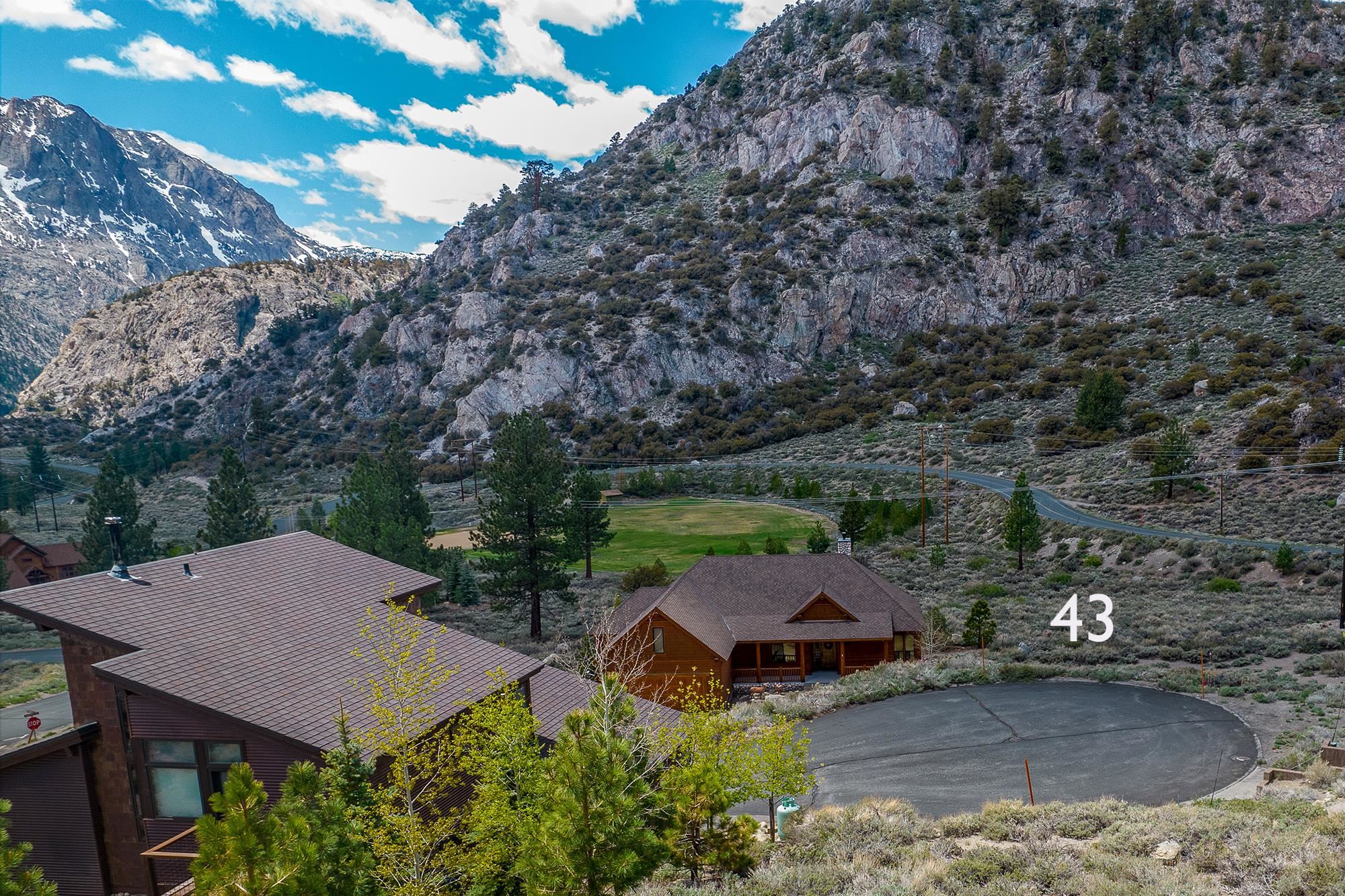 43 Highland Place June Lake, CA 93529 - Photo 3 of 24 an aerial view of a house with yard and outdoor seating