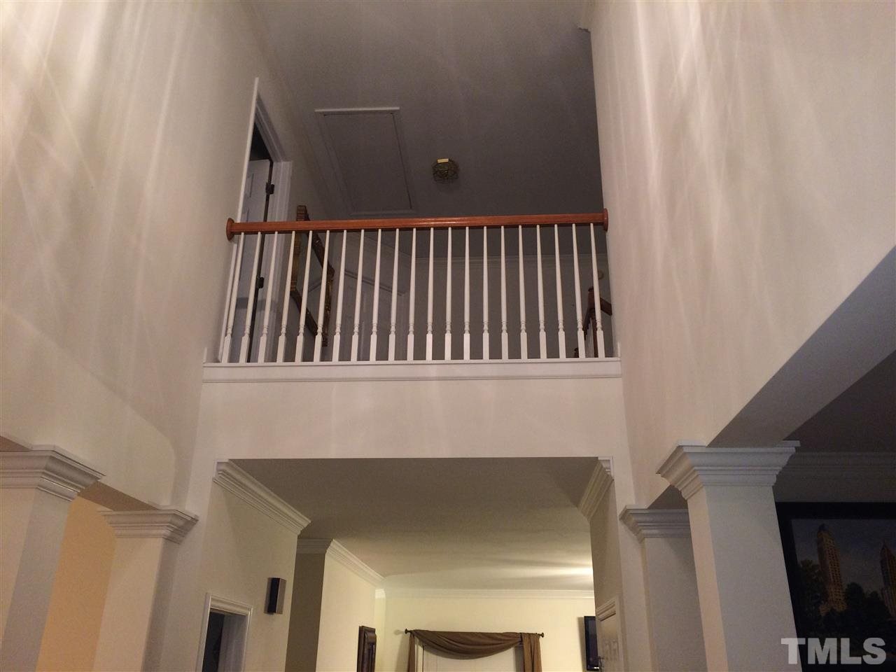 3405 Pritchard Court Raleigh, NC 27616 - Photo 11 of 11 a view of staircase with railing and a fireplace