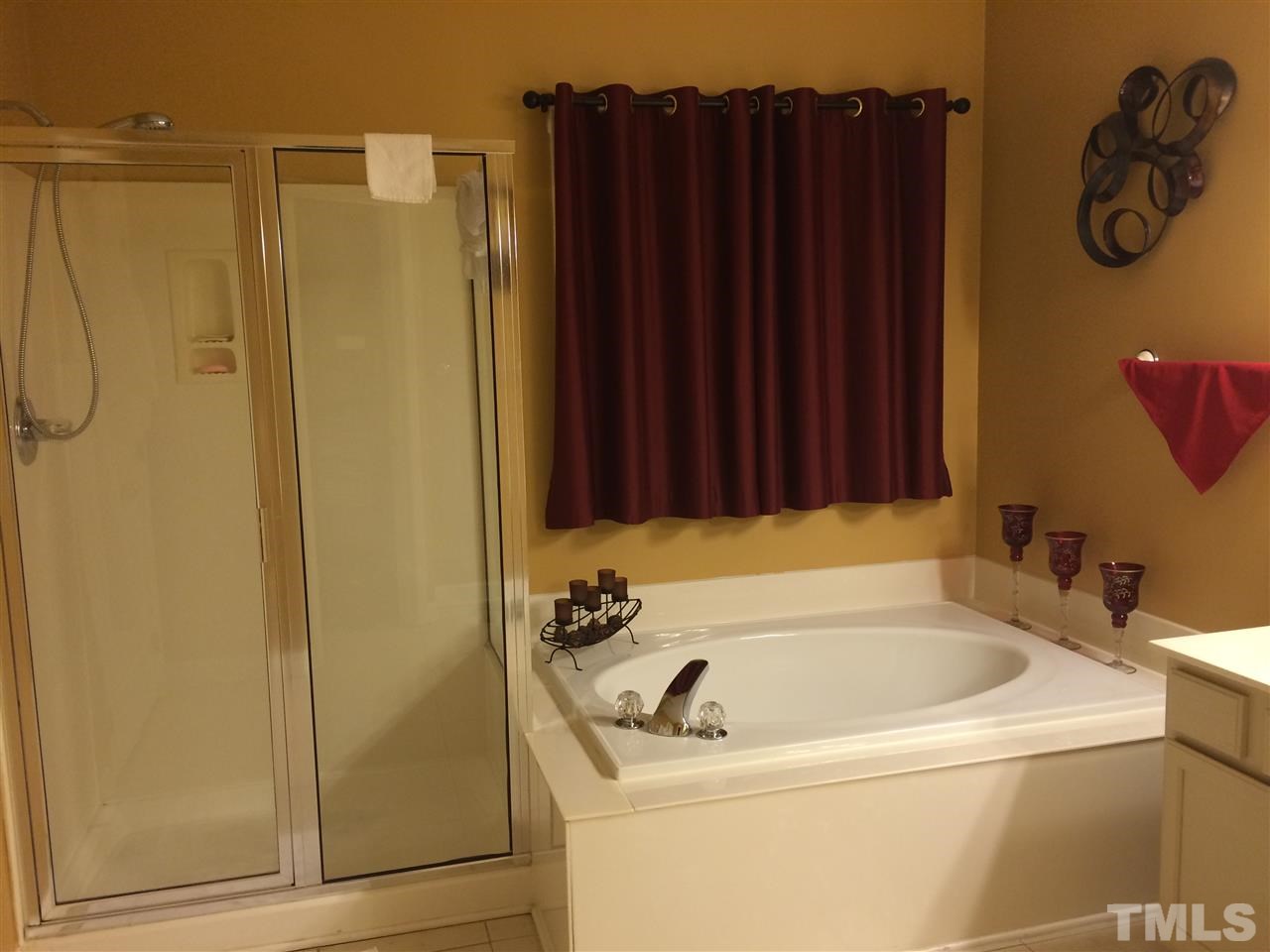 3405 Pritchard Court Raleigh, NC 27616 - Photo 9 of 11 a bathroom with a tub and a shower curtain