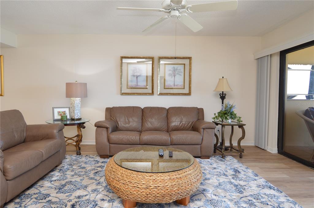 900 Gulf Boulevard, Unit 907 Indian Rocks Beach, FL 33785 - Photo 16 of 88 a living room with furniture and a potted plant