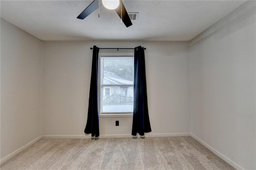 801 Davis Street Monroe, GA 30655 - Photo 24 of 33 an empty room with a window