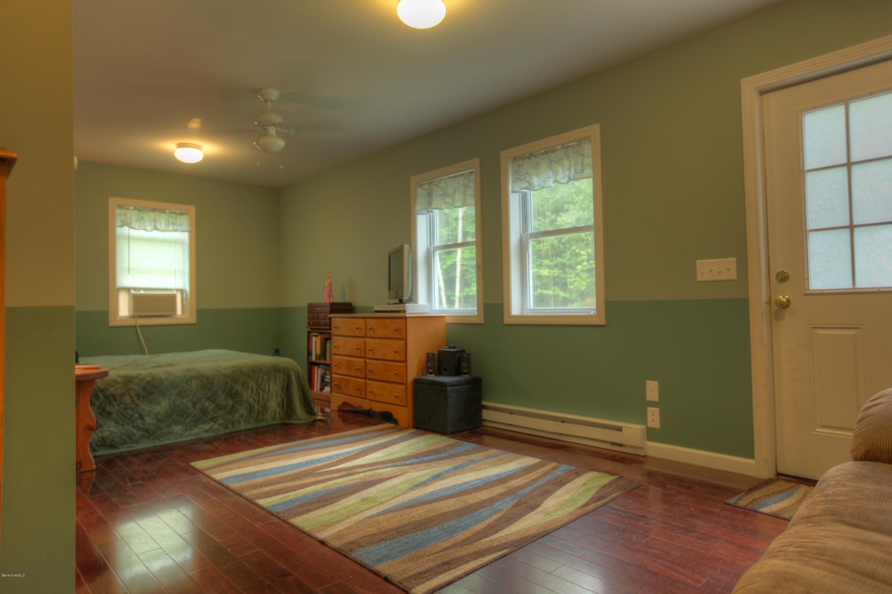 702 Becket Road Otis, MA 01029 - Photo 12 of 22 a bedroom with a bed and a window