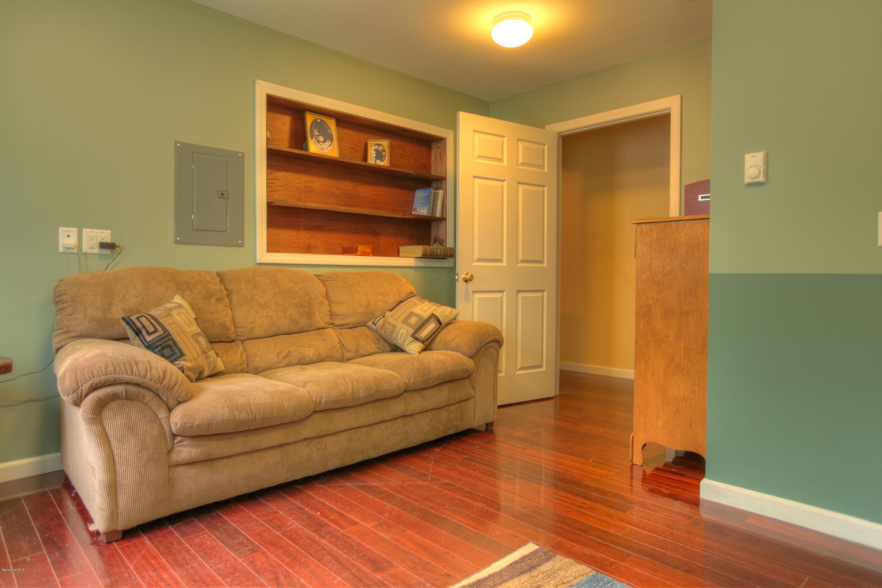 702 Becket Road Otis, MA 01029 - Photo 13 of 22 a living room with a couch and a walk in closet