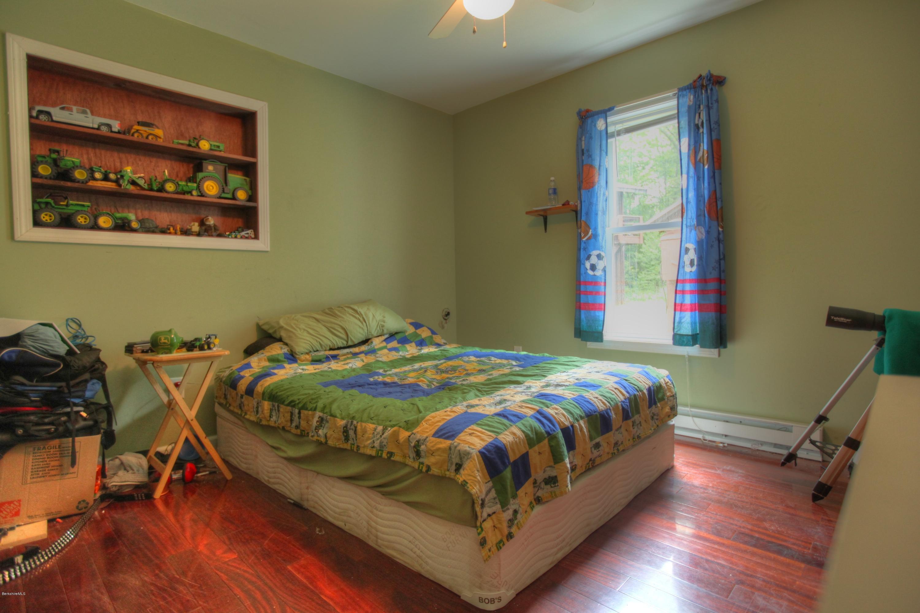702 Becket Road Otis, MA 01029 - Photo 14 of 22 a bedroom with bed and a window