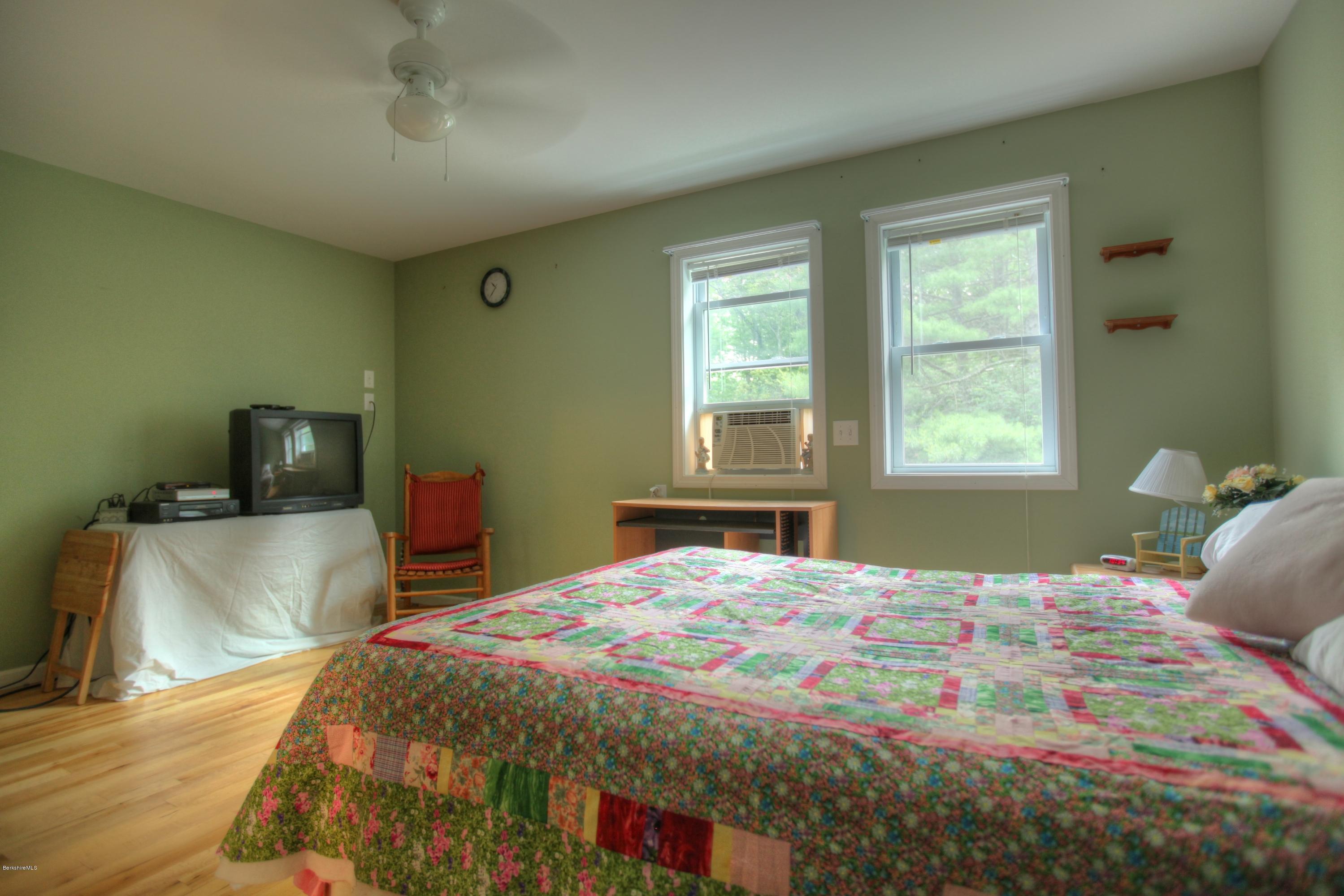 702 Becket Road Otis, MA 01029 - Photo 16 of 22 a bedroom with a bed and a tv