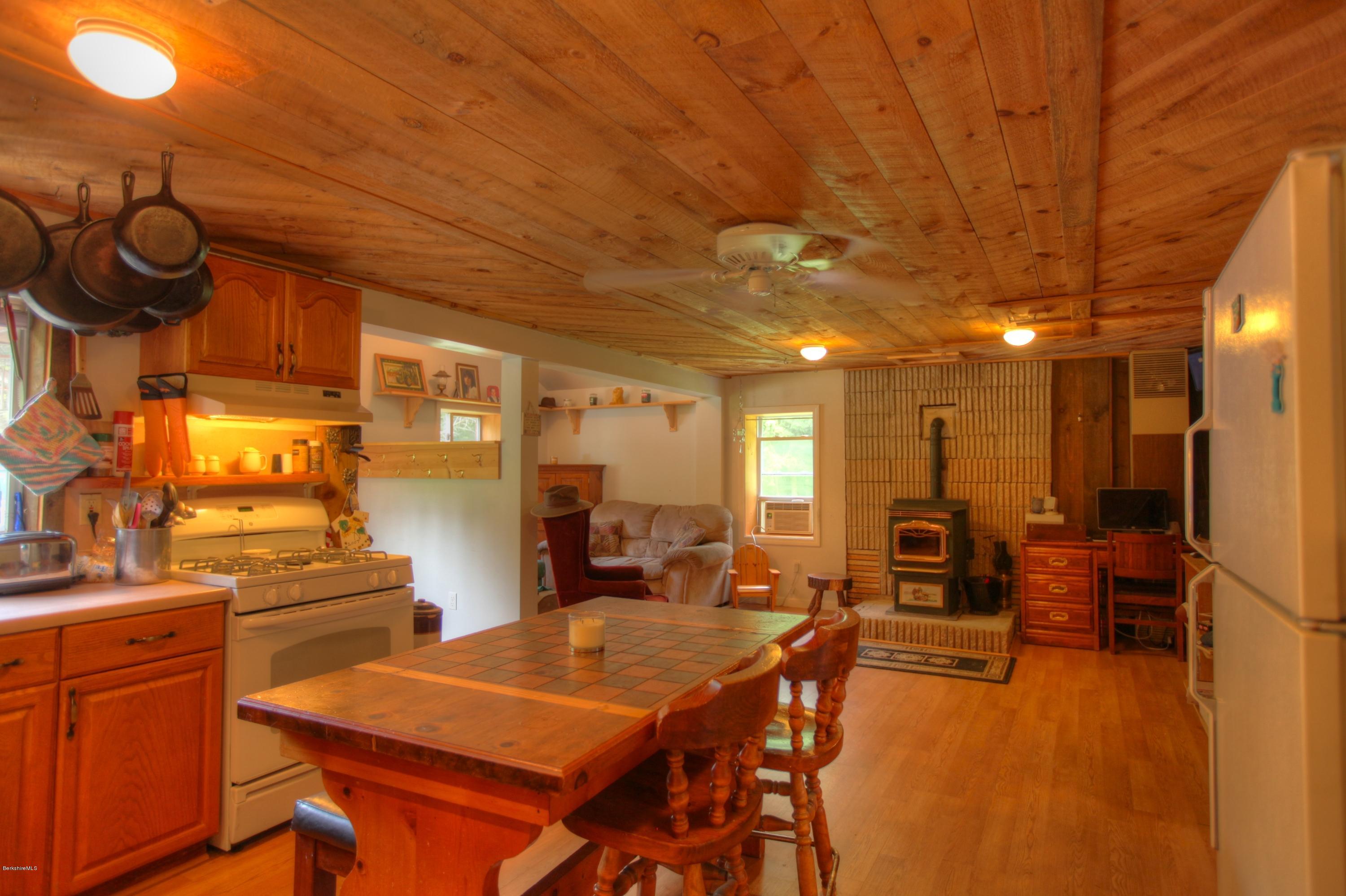702 Becket Road Otis, MA 01029 - Photo 18 of 22 a room with lots of furniture and air hockey table