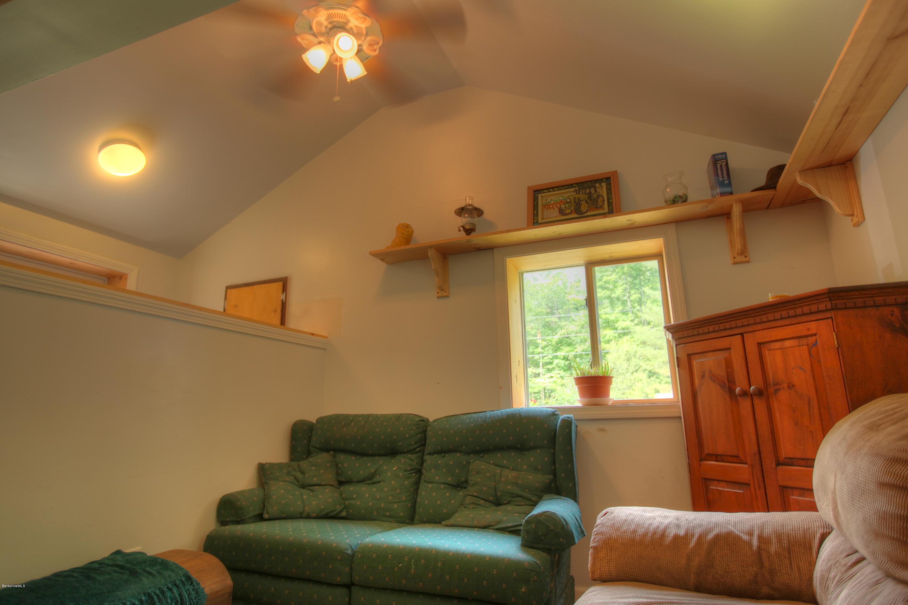 702 Becket Road Otis, MA 01029 - Photo 19 of 22 a living room with furniture and a window