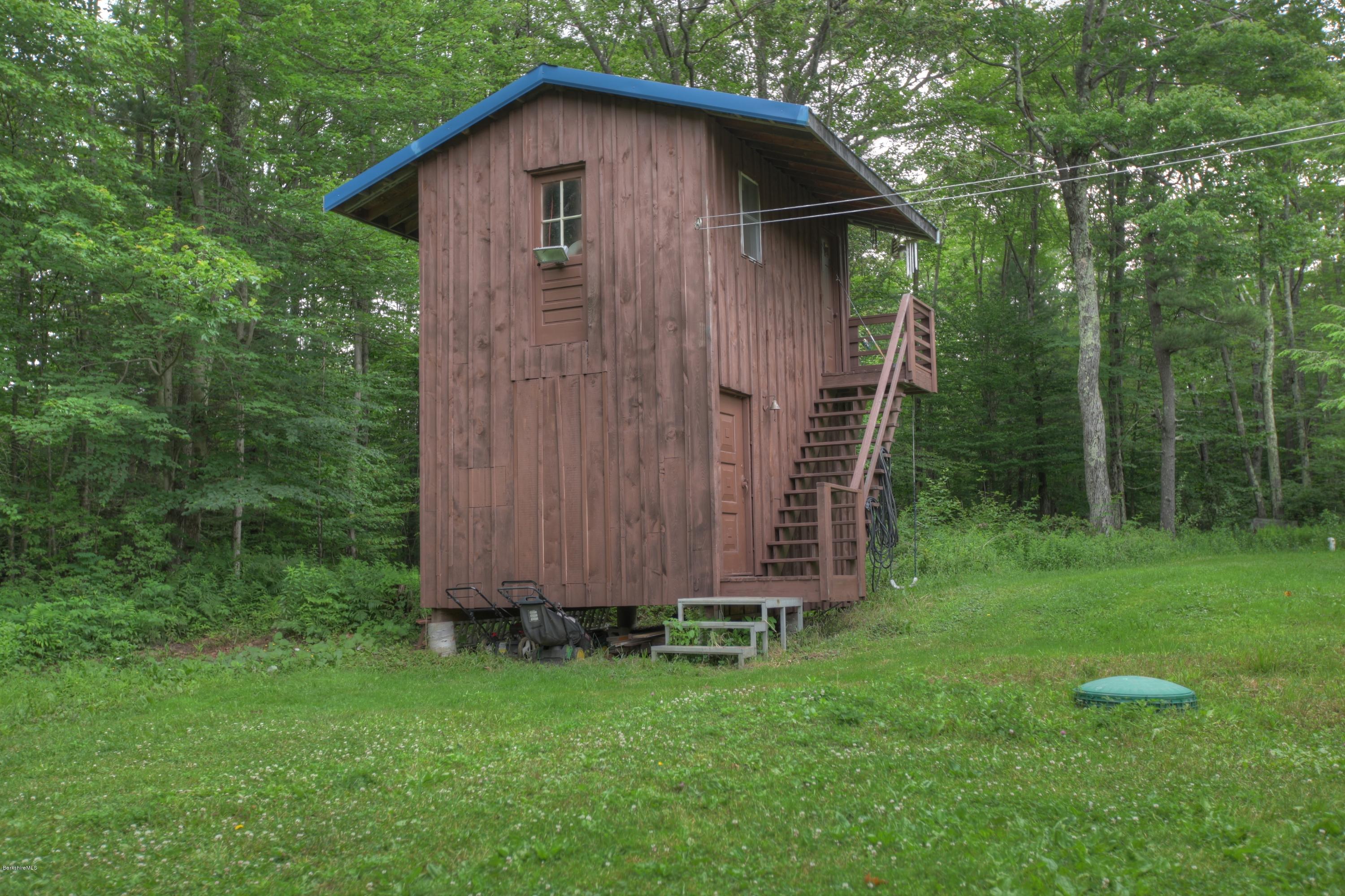 702 Becket Road Otis, MA 01029 - Photo 3 of 22 a backyard of a house with lots of green space