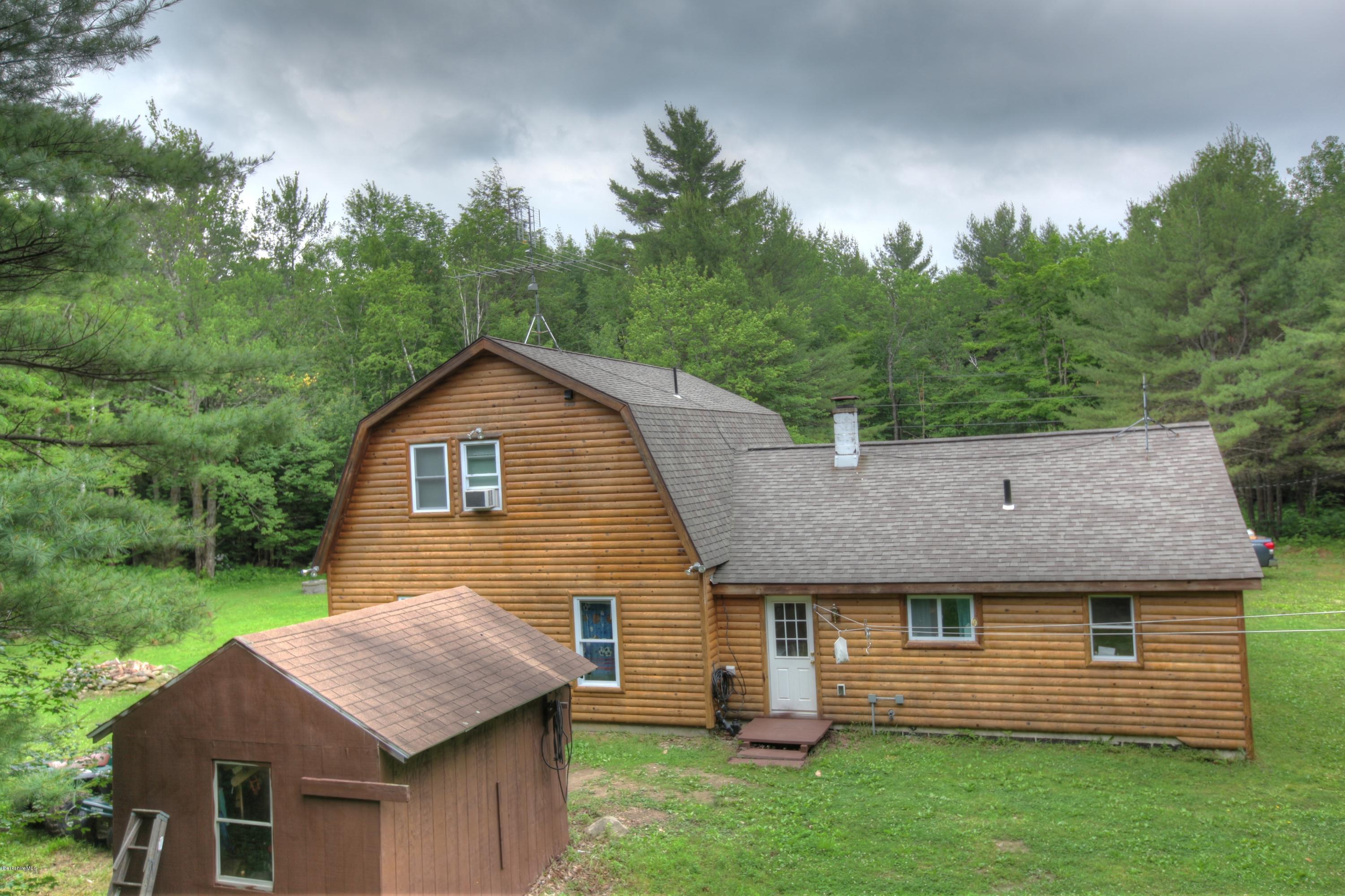 702 Becket Road Otis, MA 01029 - Photo 4 of 22 a aerial view of a house with a yard