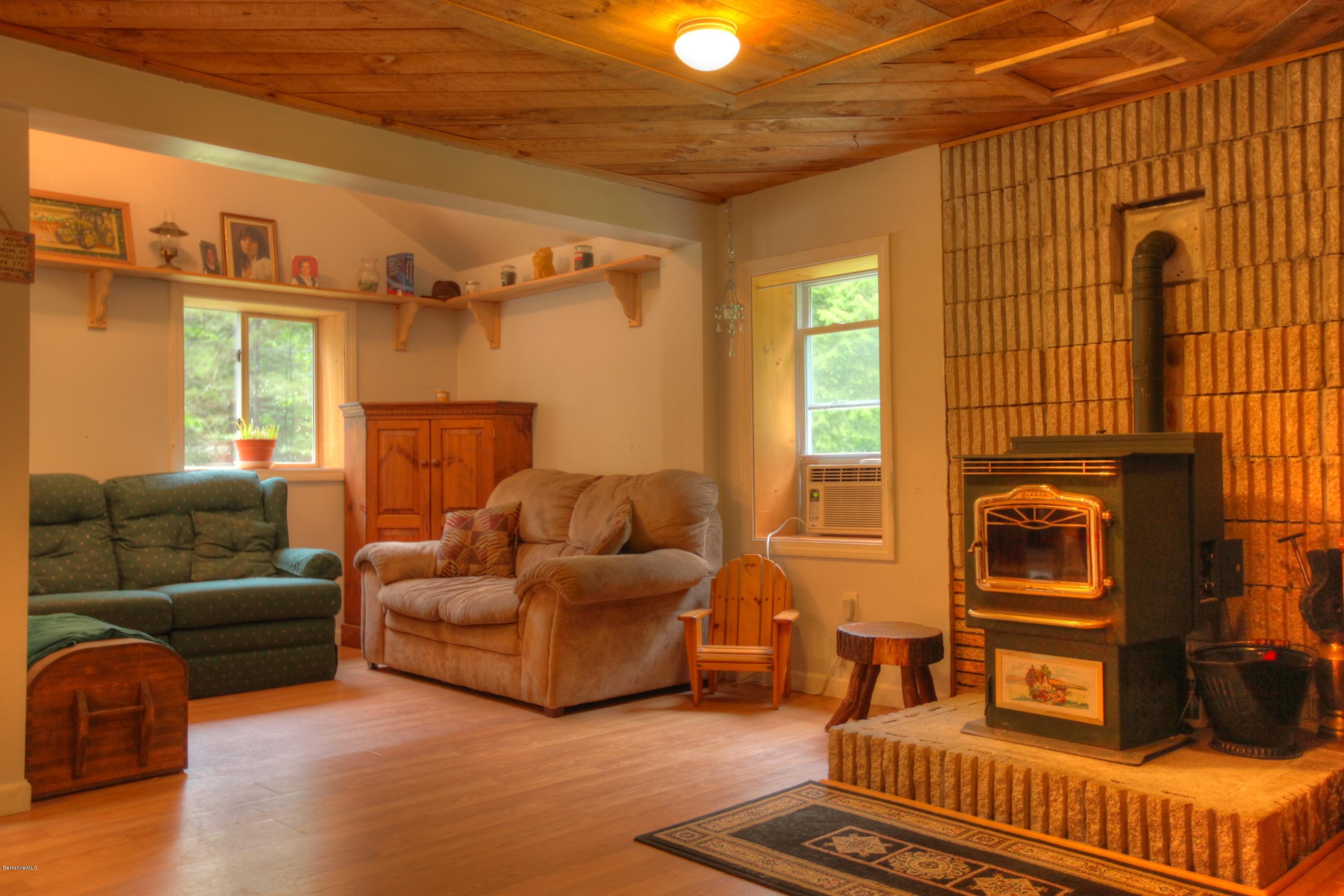 702 Becket Road Otis, MA 01029 - Photo 6 of 22 a living room with furniture and a window
