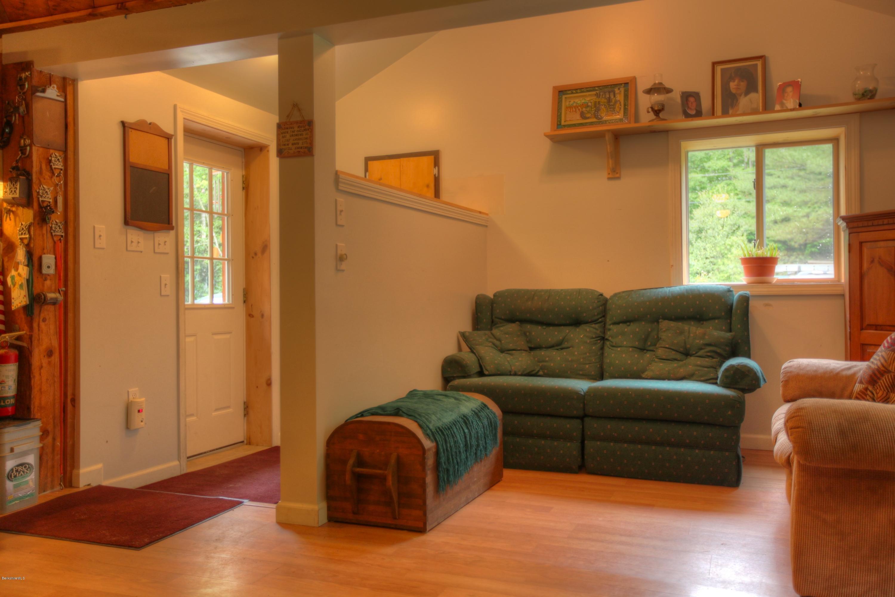 702 Becket Road Otis, MA 01029 - Photo 7 of 22 a living room with furniture and a window