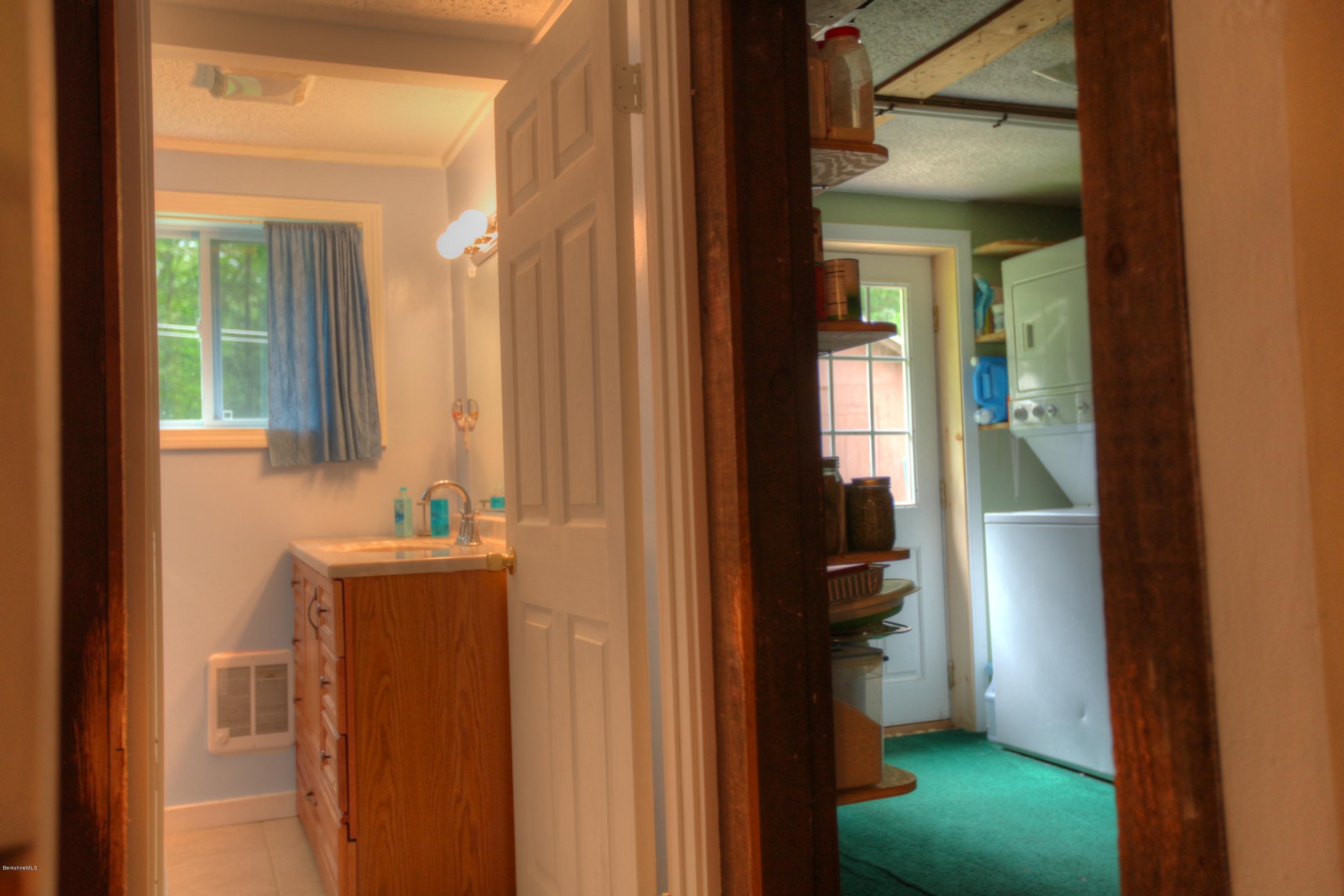 702 Becket Road Otis, MA 01029 - Photo 10 of 22 a bathroom with a sink and a mirror
