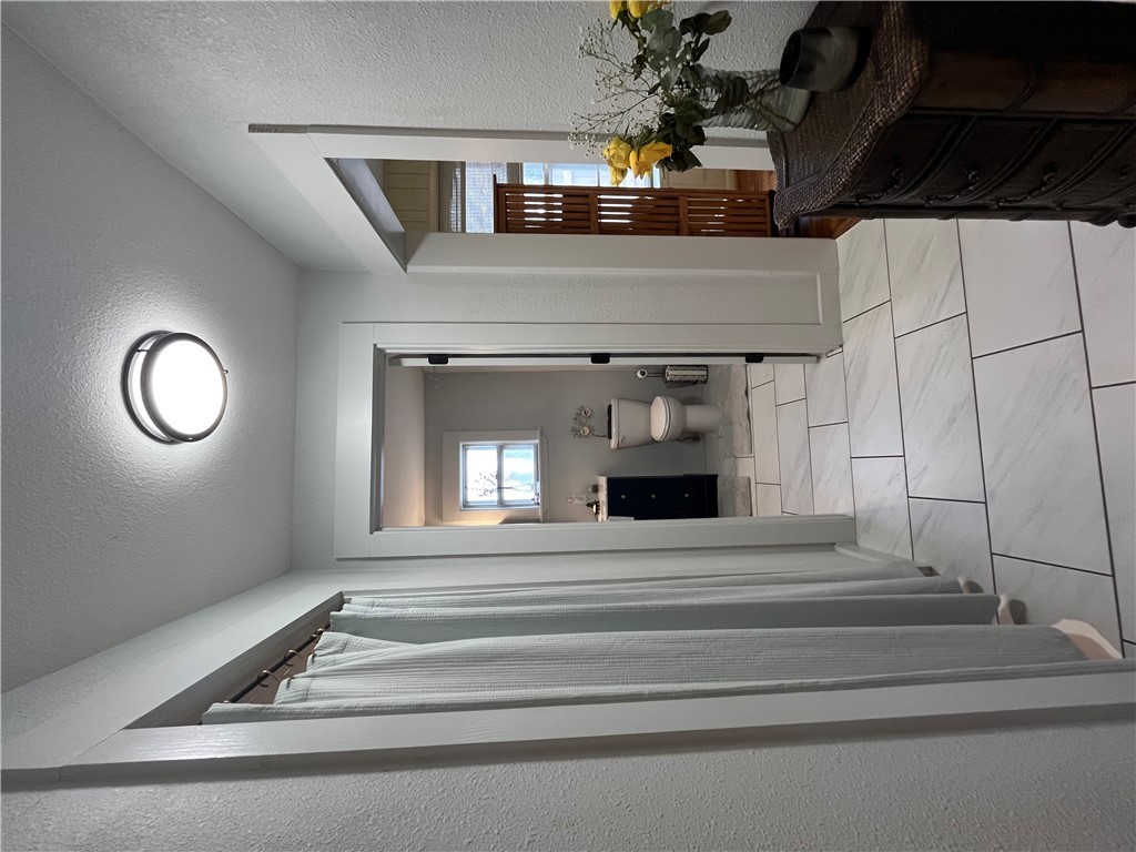 1102 North Travis Avenue Cameron, TX 76520 - Photo 11 of 48 a bathroom with a sink and a mirror