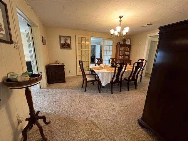 a view of a livingroom with furniture and a window