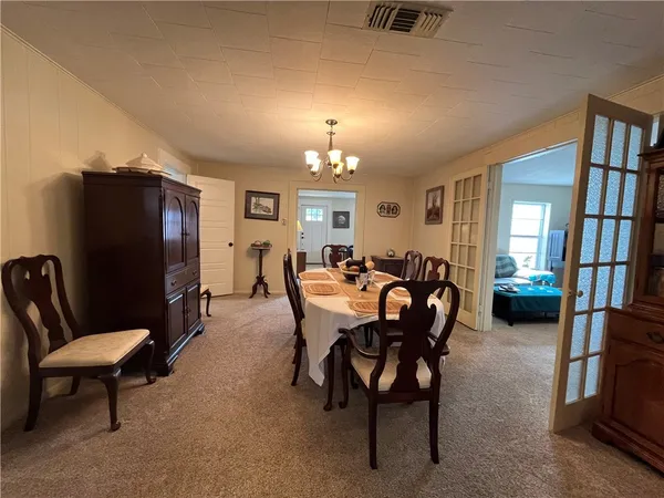 a view of a livingroom with furniture and a flat screen tv