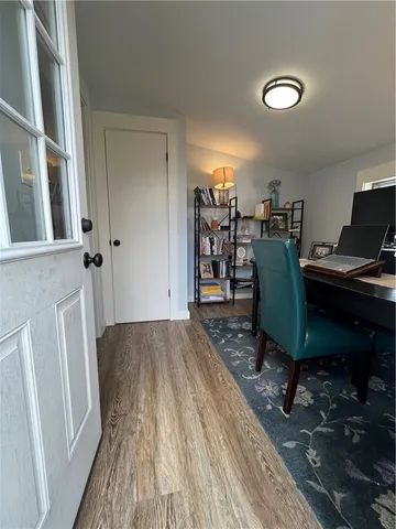 a workspace with furniture and wooden floor