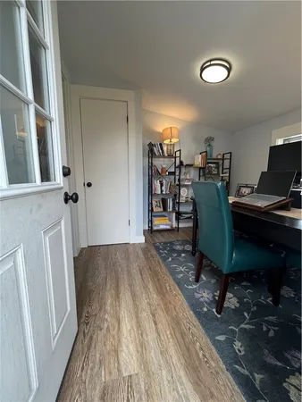 a workspace with furniture and wooden floor