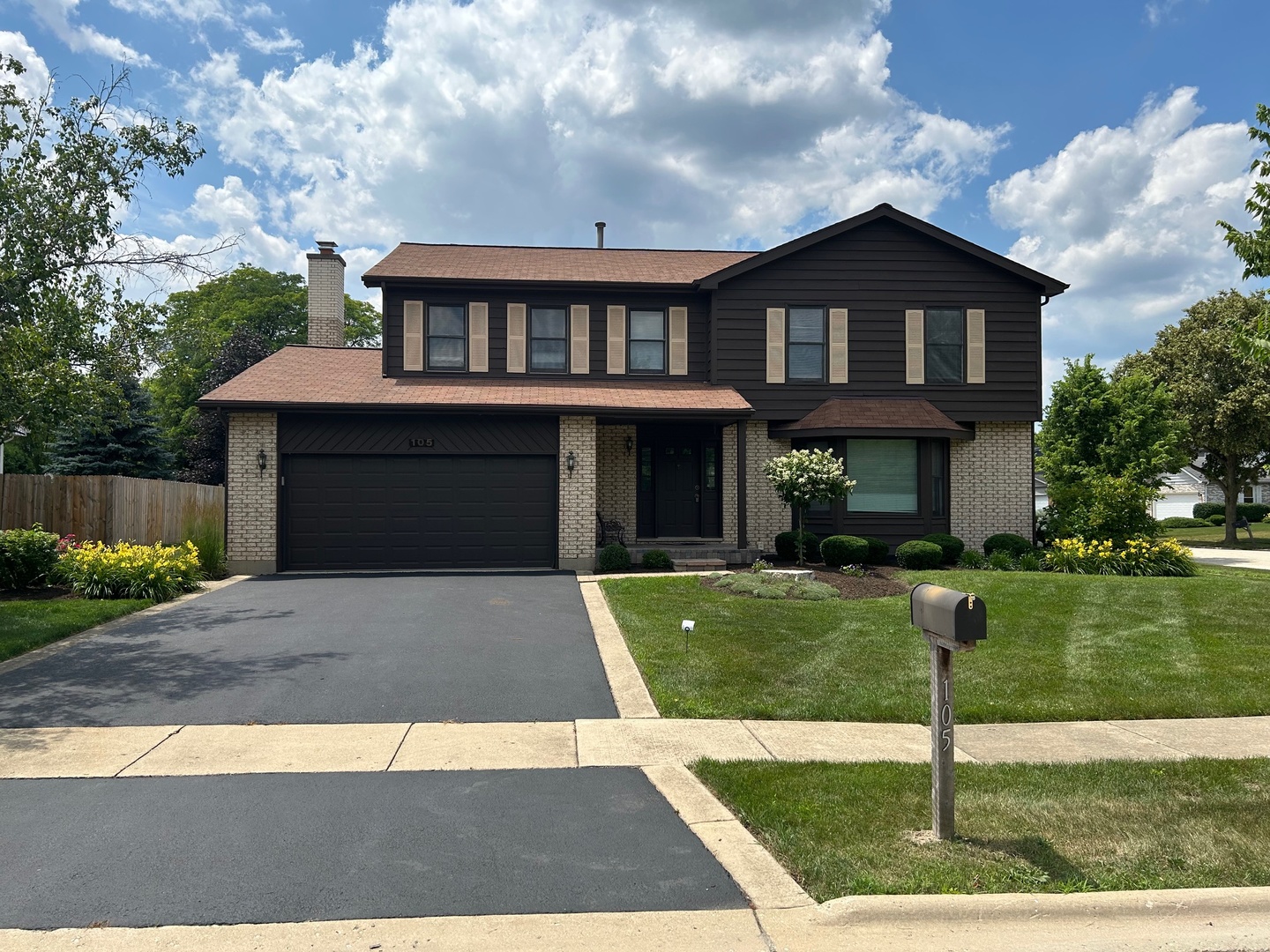 105 Golfview Circle Prospect Heights, IL 60070 - Photo 1 of 23 a front view of a house with a yard