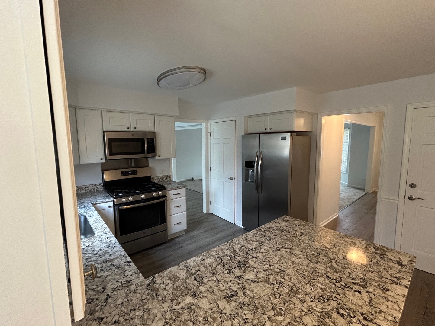 105 Golfview Circle Prospect Heights, IL 60070 - Photo 11 of 23 a kitchen with stainless steel appliances granite countertop a refrigerator stove and sink