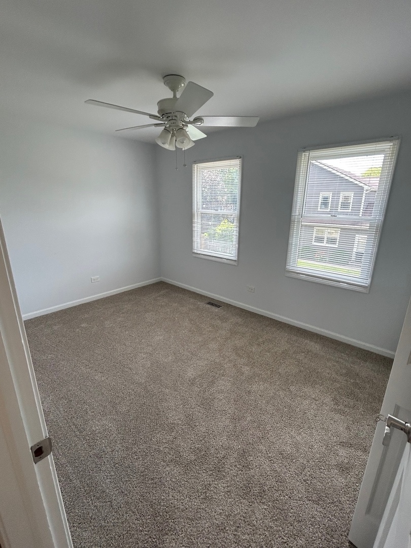 105 Golfview Circle Prospect Heights, IL 60070 - Photo 19 of 23 a view of an empty room with a window