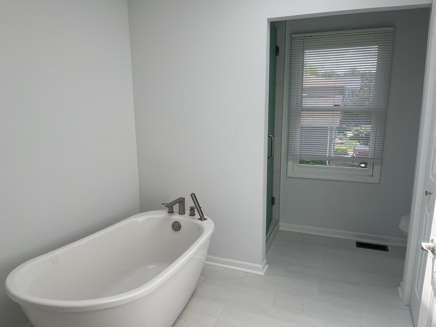 105 Golfview Circle Prospect Heights, IL 60070 - Photo 22 of 23 a white bath tub sitting in a bathroom