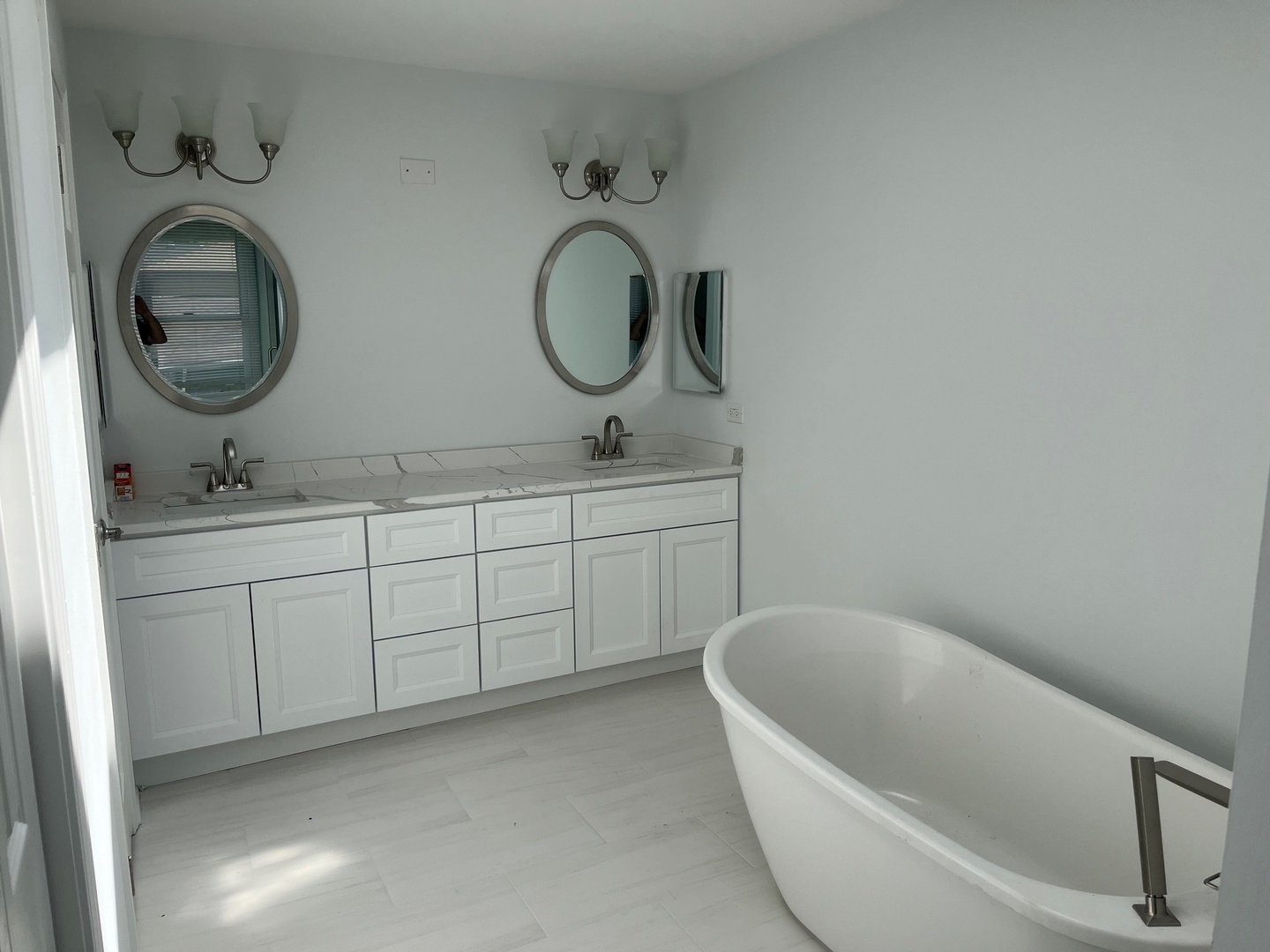 105 Golfview Circle Prospect Heights, IL 60070 - Photo 23 of 23 a bathroom with a double vanity sink a mirror and bathtub