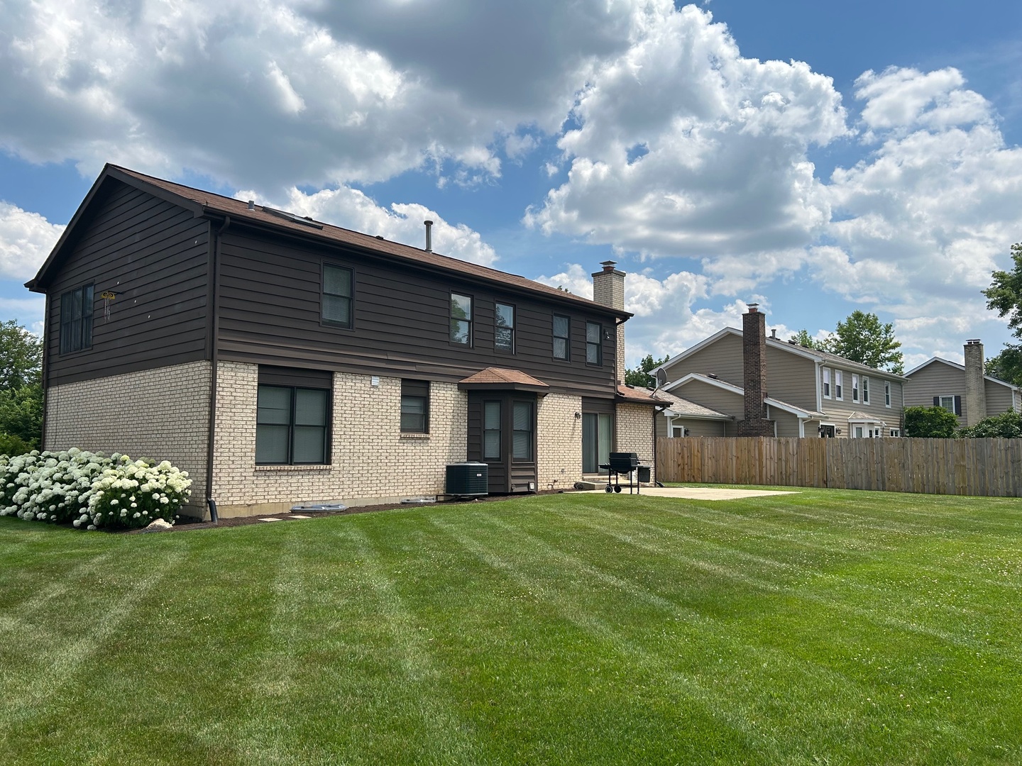 105 Golfview Circle Prospect Heights, IL 60070 - Photo 3 of 23 a front view of a house with a garden