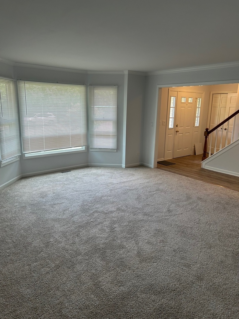 105 Golfview Circle Prospect Heights, IL 60070 - Photo 7 of 23 a view of an empty room with a window