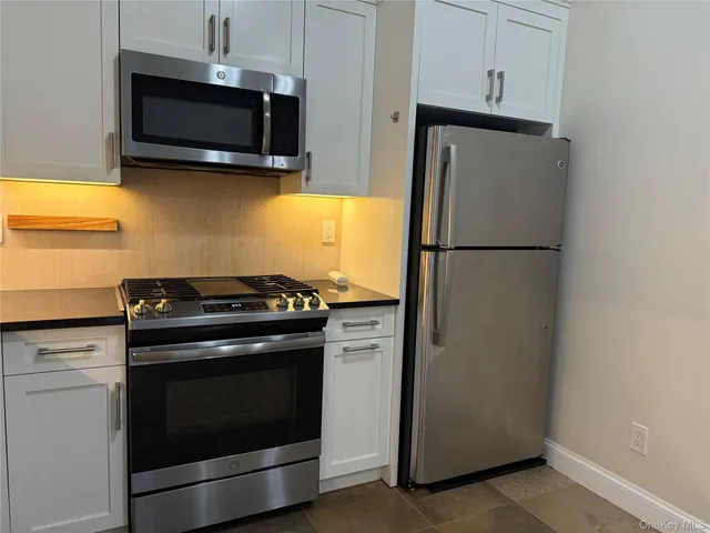 a front view of a building with parking area