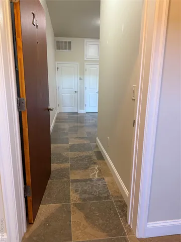 a bathroom with a sink vanity mirror and toilet