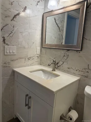 a view of hallway with wooden floor