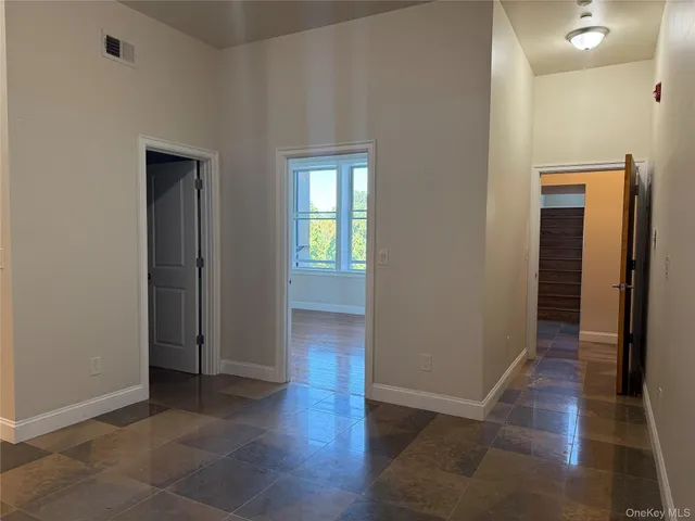 a view of a refrigerator and utility room