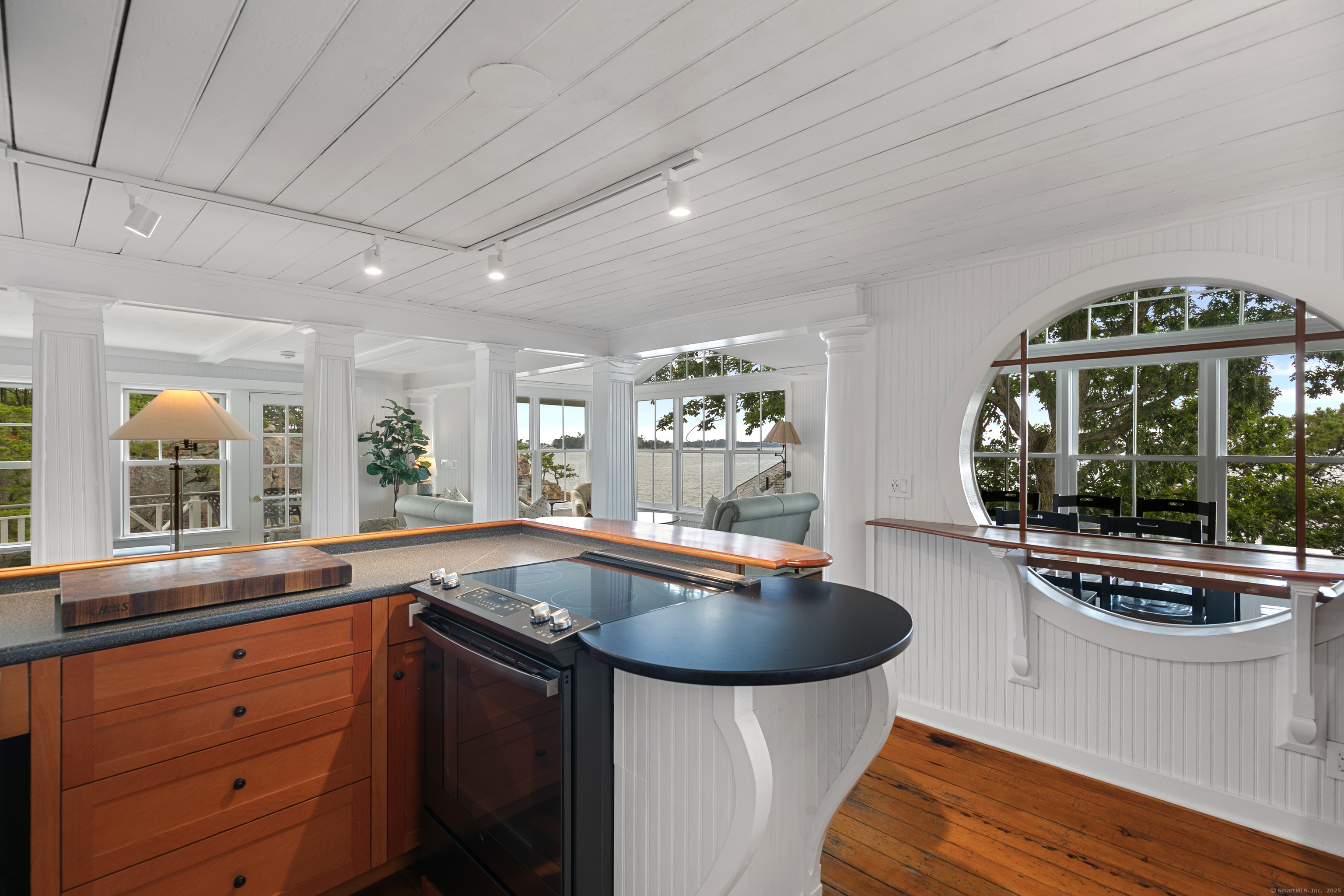 33 Thimble Farms Road Branford, CT 06405 - Photo 11 of 40 a kitchen with stainless steel appliances granite countertop a sink a stove and a wooden cabinets