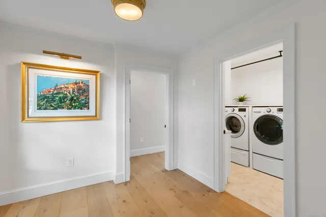 a view of a storage & utility room with a washer dryer