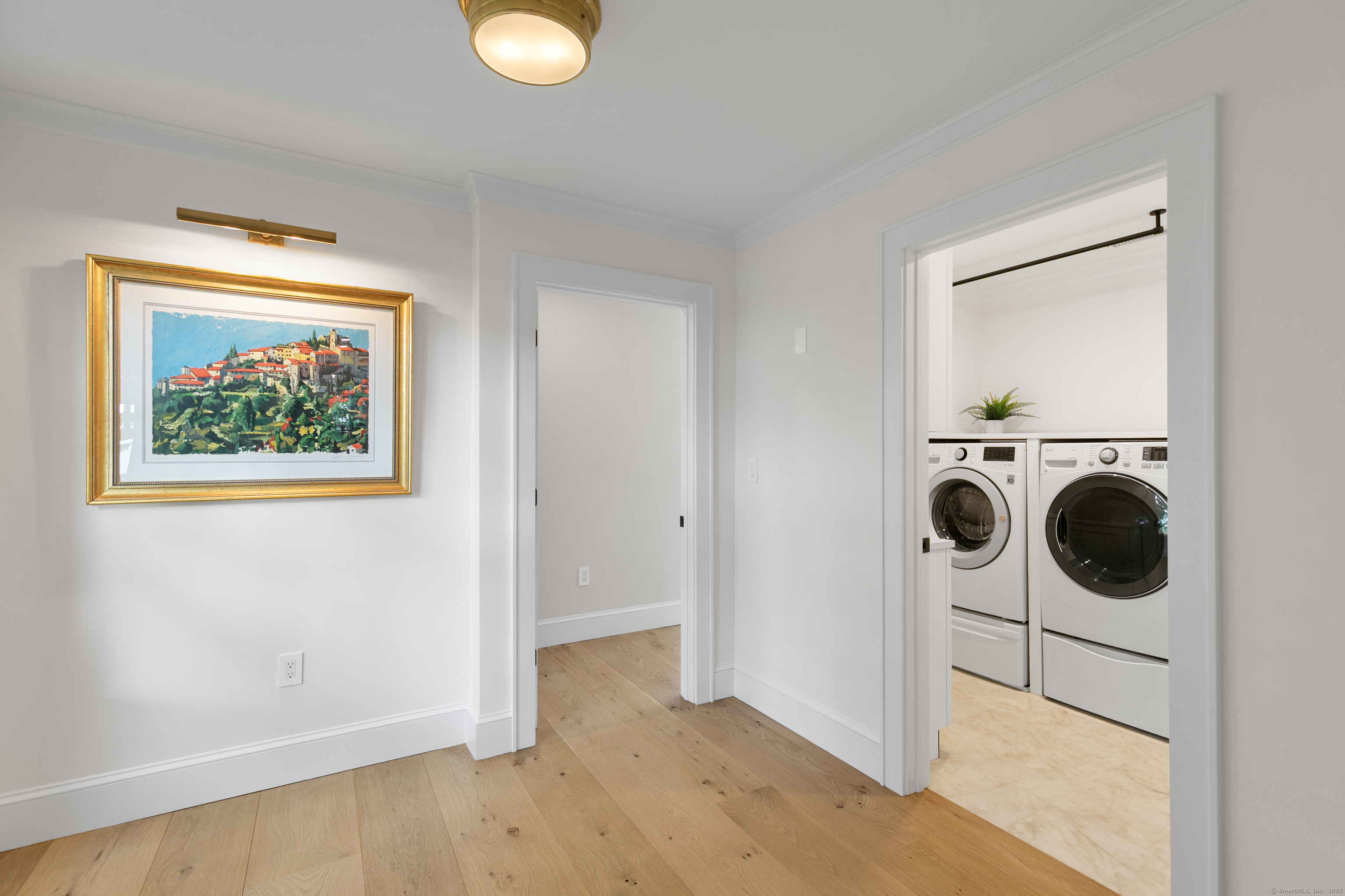 33 Thimble Farms Road Branford, CT 06405 - Photo 12 of 40 a view of a storage & utility room with a washer dryer