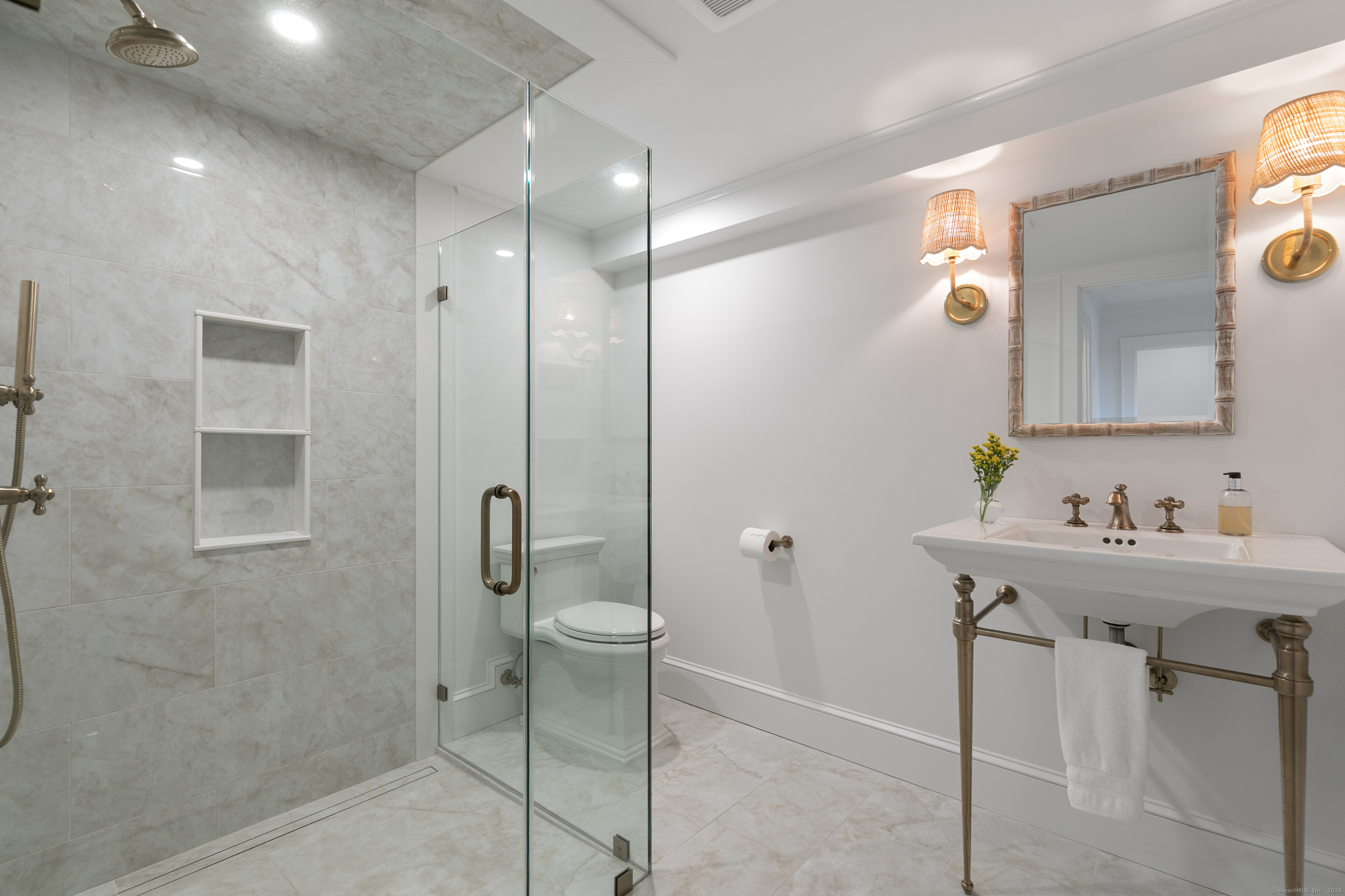 33 Thimble Farms Road Branford, CT 06405 - Photo 13 of 40 a bathroom with a sink a toilet and shower