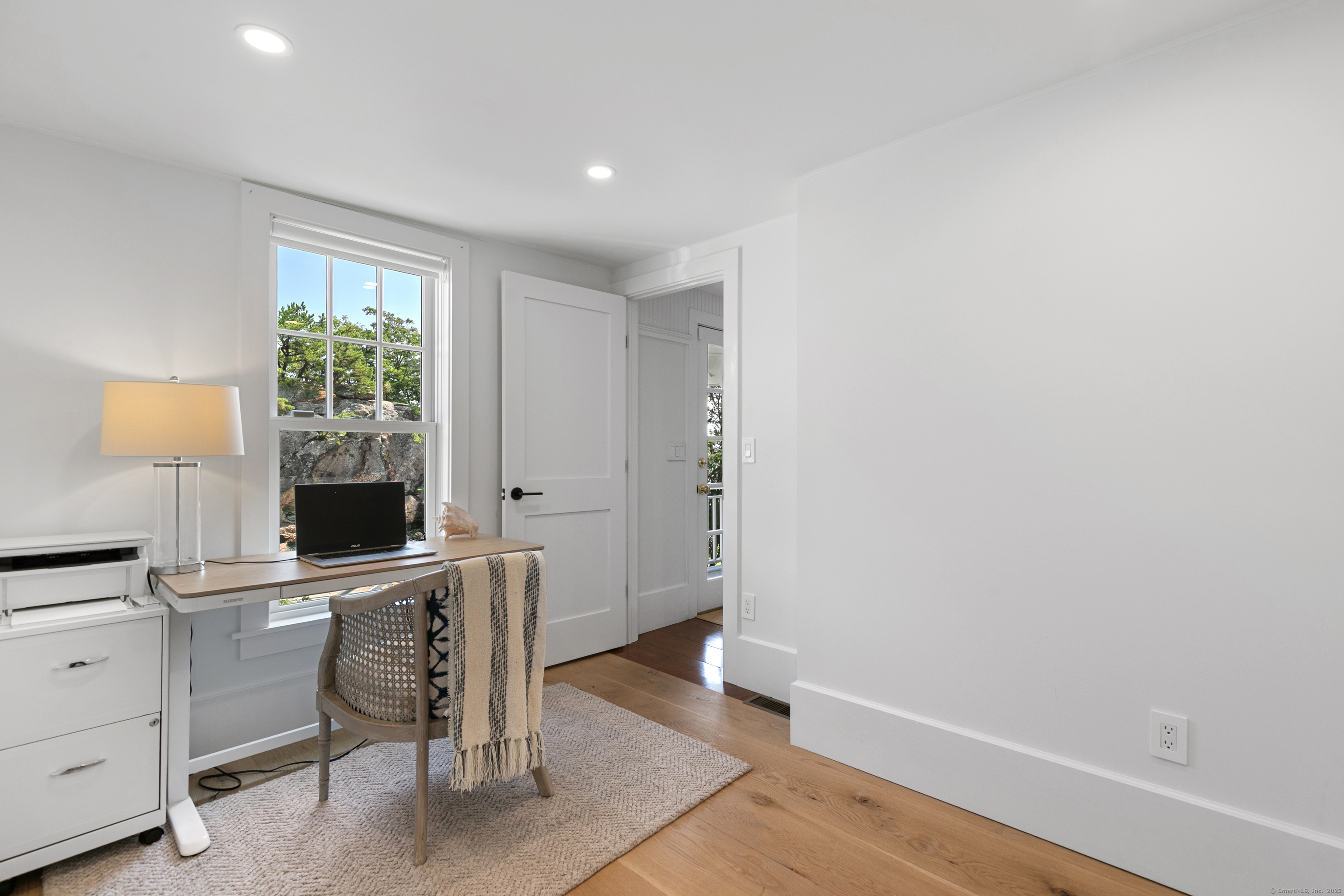33 Thimble Farms Road Branford, CT 06405 - Photo 25 of 40 a view of a workspace with furniture and a window