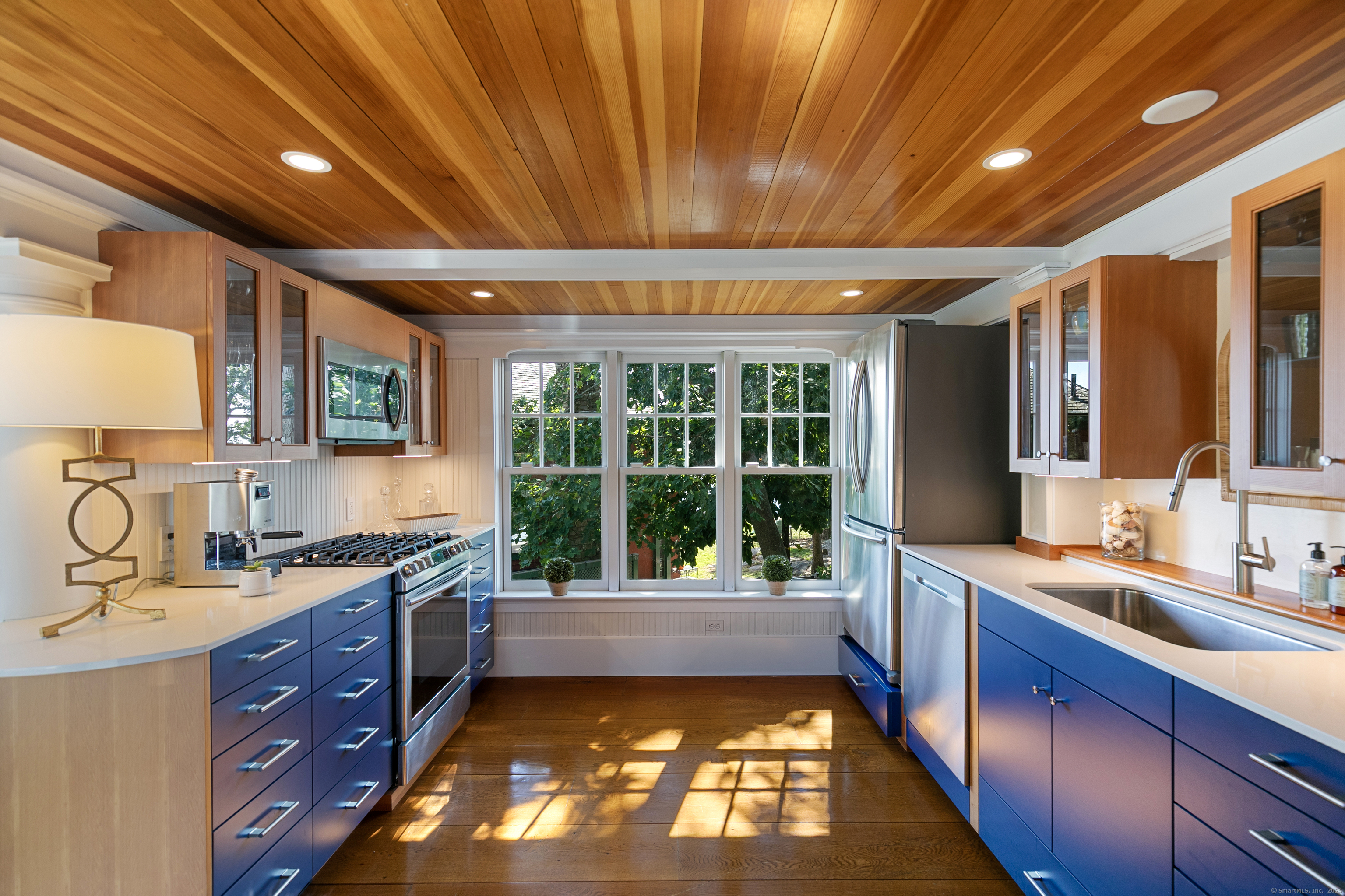 33 Thimble Farms Road Branford, CT 06405 - Photo 27 of 40 a large kitchen with kitchen island granite countertop a sink and a large window