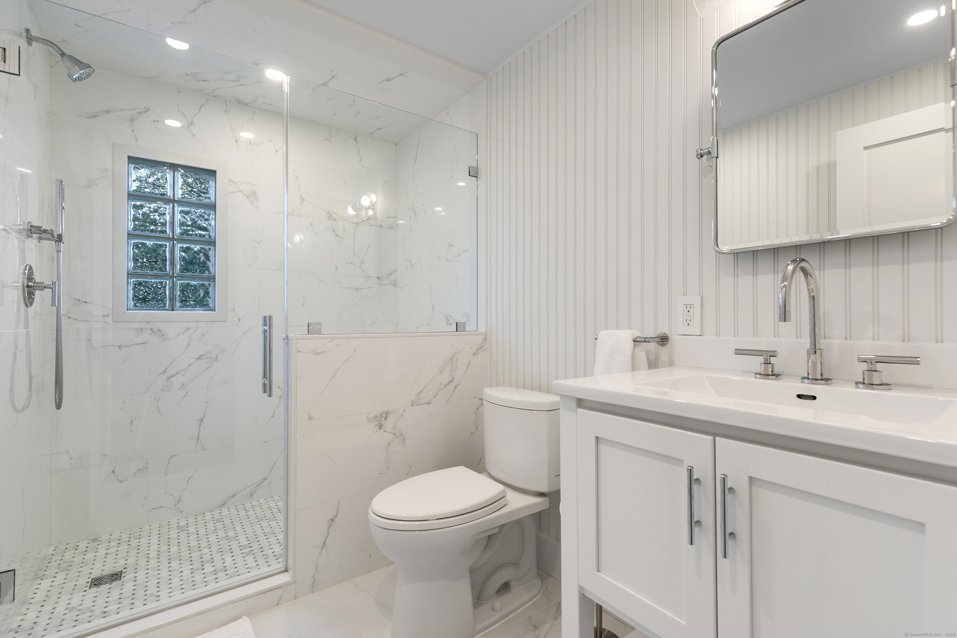 33 Thimble Farms Road Branford, CT 06405 - Photo 29 of 40 a bathroom with a sink a toilet and shower