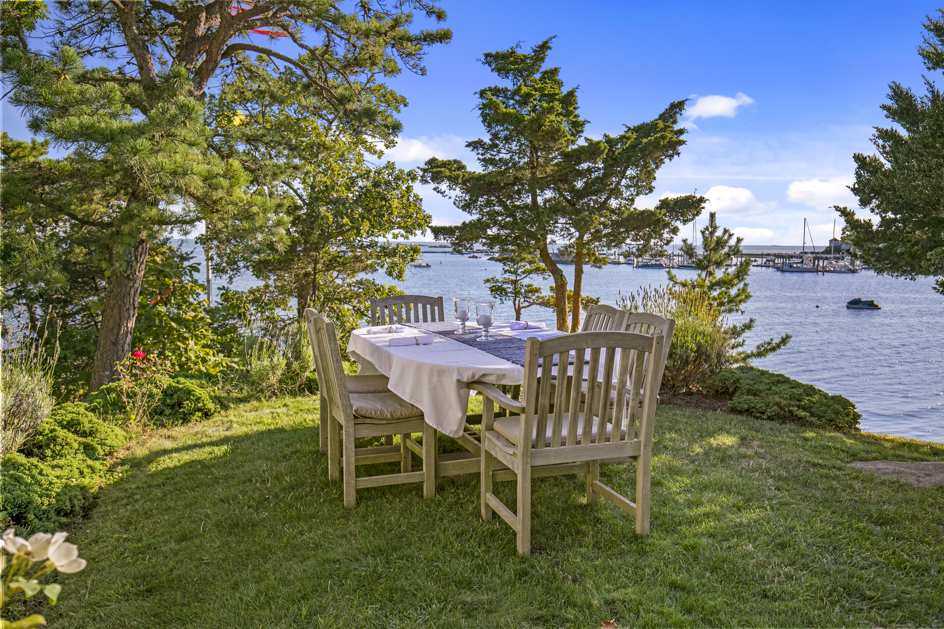 33 Thimble Farms Road Branford, CT 06405 - Photo 33 of 40 a table and chairs in a garden