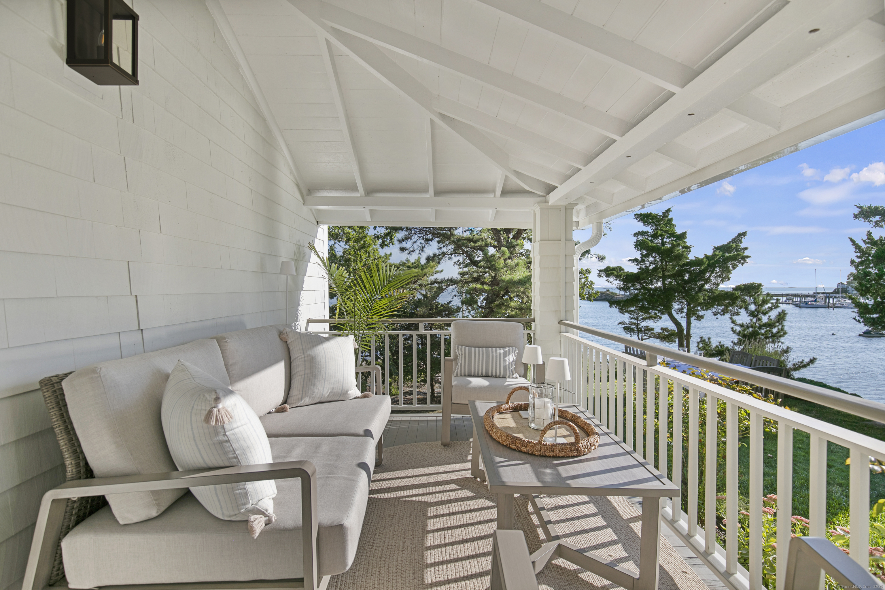 33 Thimble Farms Road Branford, CT 06405 - Photo 35 of 40 a balcony with furniture and potted plants