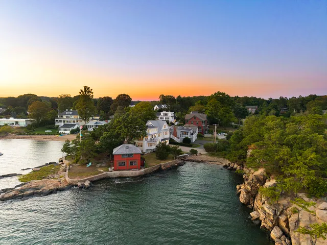 a view of a lake in middle of forest