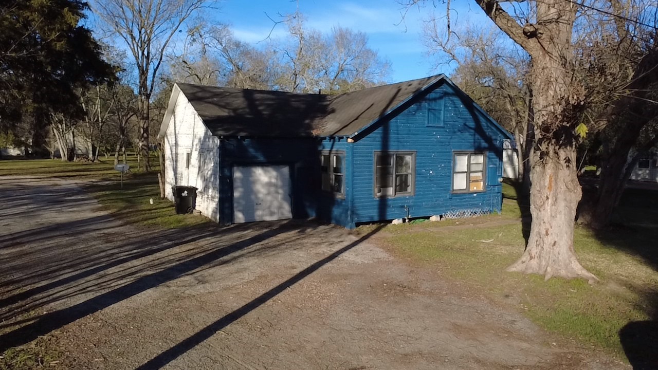1419 Leaman Avenue Rosenberg, TX 77471 - Photo 2 of 17 a front view of a house with a yard