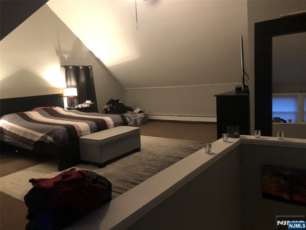 63 Highland Cross, Unit 2 Rutherford, NJ 07070 - Photo 17 of 19 a en suite bathroom with a sink and mirror