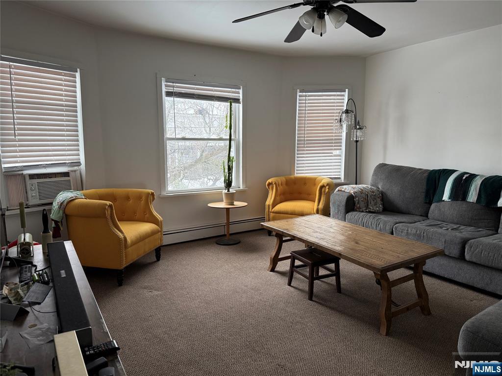 63 Highland Cross, Unit 2 Rutherford, NJ 07070 - Photo 2 of 19 a living room with furniture and a window