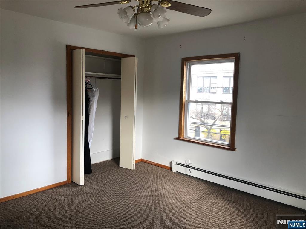 63 Highland Cross, Unit 2 Rutherford, NJ 07070 - Photo 7 of 19 an empty room with a window