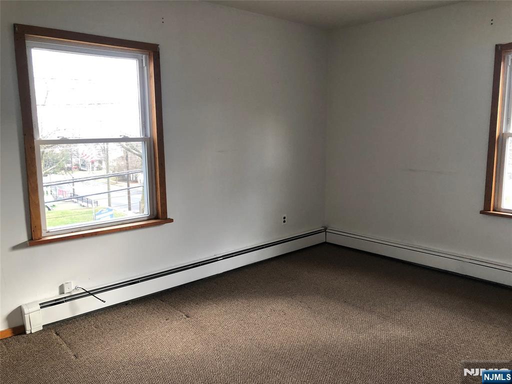 63 Highland Cross, Unit 2 Rutherford, NJ 07070 - Photo 8 of 19 an empty room with a window