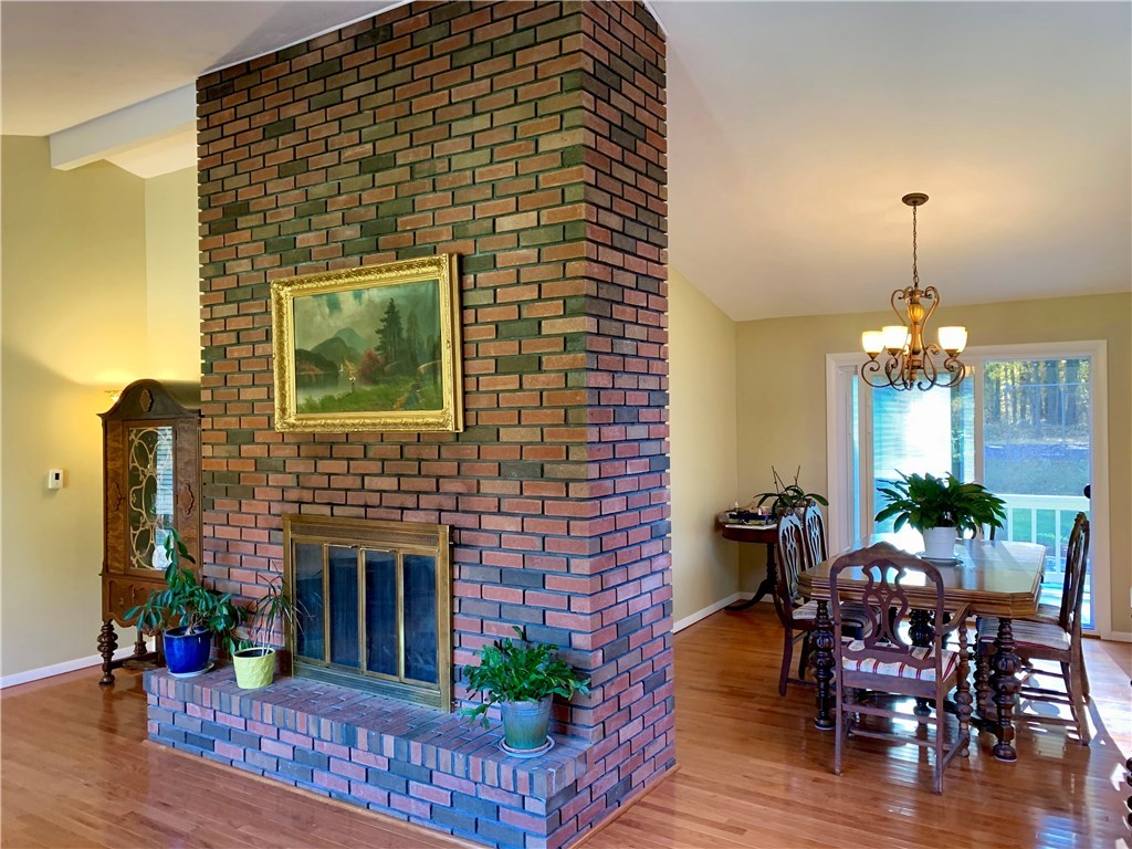 8 Cynthia Road Lincoln, RI 02865 - Photo 4 of 28 Livingroom fireplace dining room